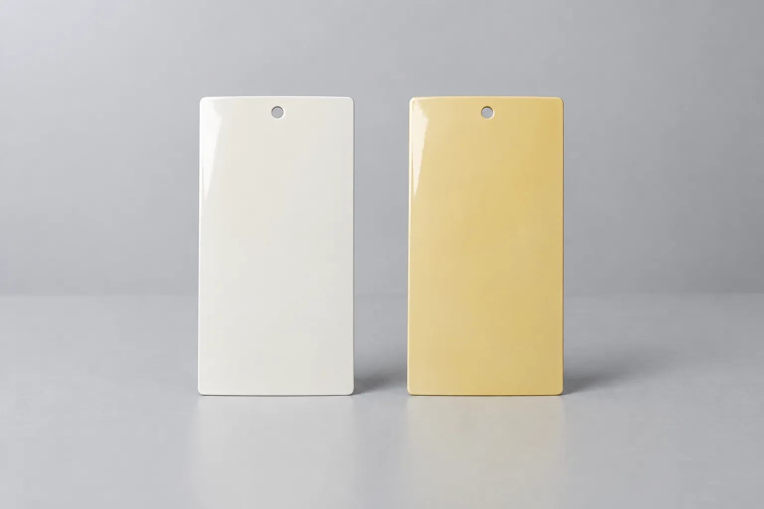Alkyd coating panels comparing fresh cream finish versus yellowed film